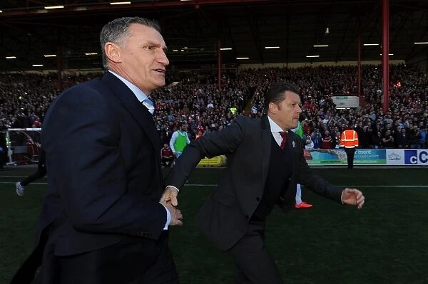Bristol City Claims League Victory: Cotterill and Mowbray Share a Handshake Amidst Fans Euphoria