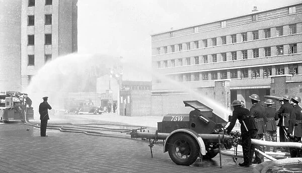 Auxiliary firefighters at drill, Lambeth HQ, WW2