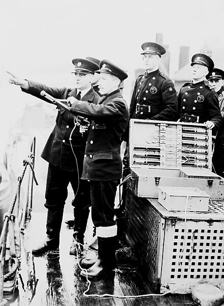 Auxiliary London firemen at drill on a fireboat, WW2