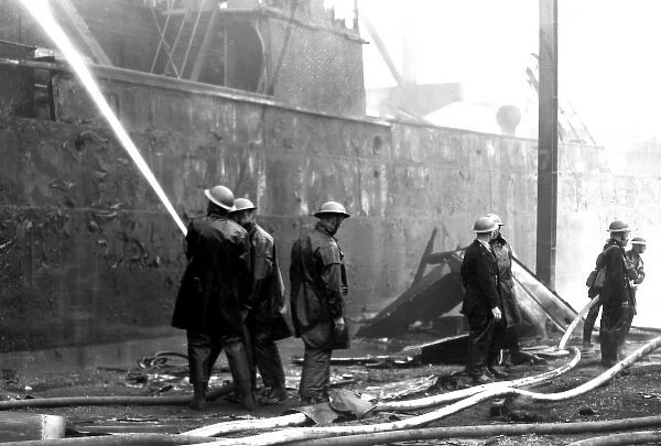 Blitz in London -- burnt out cargo ship, Rotherhithe, WW2