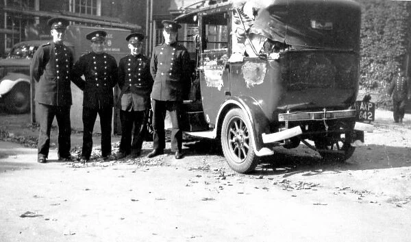 Blitz in London -- firefighters with damaged vehicle, WW2