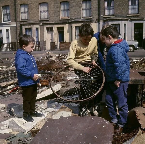 Boys with bent wheel, Balham, SW London