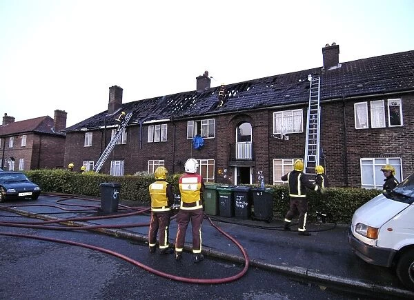 Firefighers at the scene of a house fire, SE London