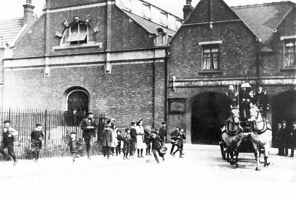 Firefighters answering a call, Barking fire station, Essex