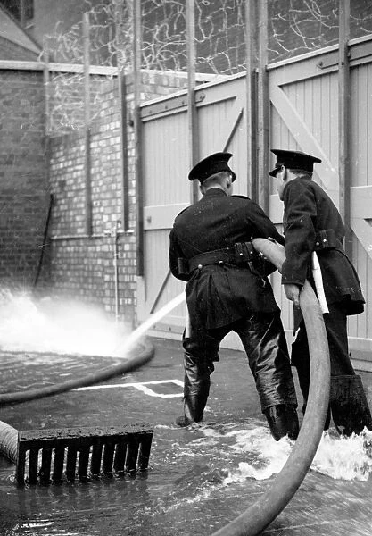 Firefighters controlling jet of water, Brigade HQ, Lambeth