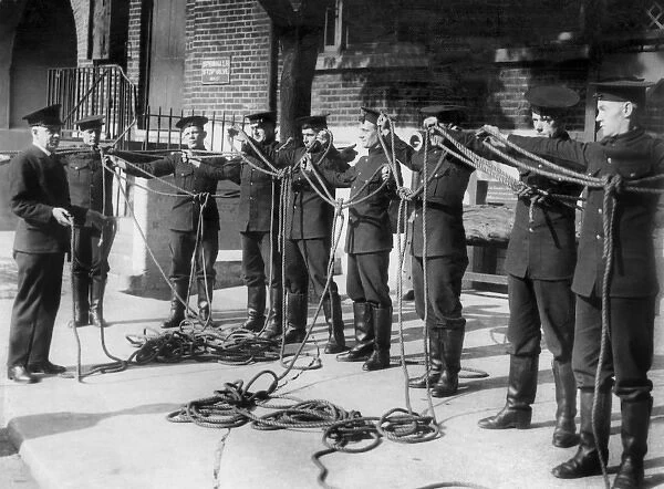 Firefighters receiving knots instruction
