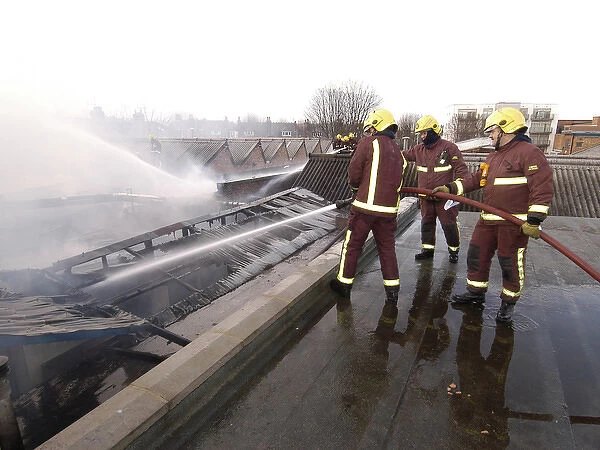Firefighters at scene of commercial premises fire