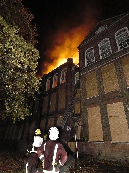 Firefighters at the scene of a school fire, SE London