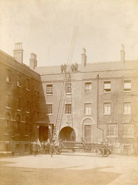 Firefighters using a wheeled ladder escape