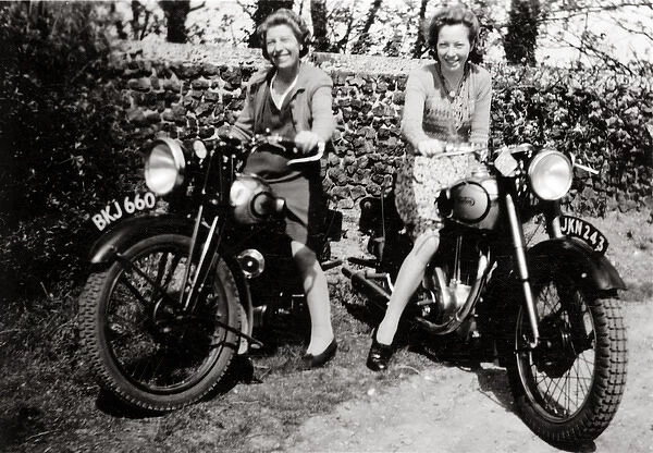 Ladies sitting on 1935 & 1950 motorcycles