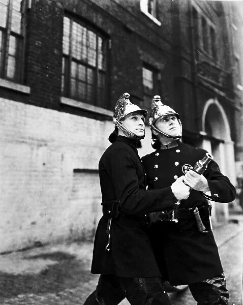LCC-LFB Two firemen at hose drill, Southwark SE1