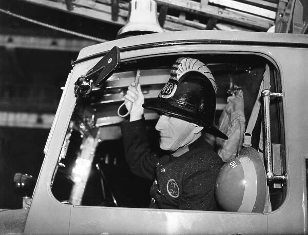 LFB firefighter in enclosed pump vehicle