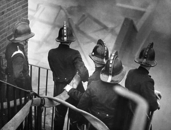 London firefighters at work on staircase, Carron Wharf
