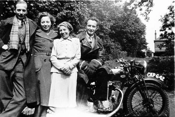 Four people with a 1936 BSA motorcycle