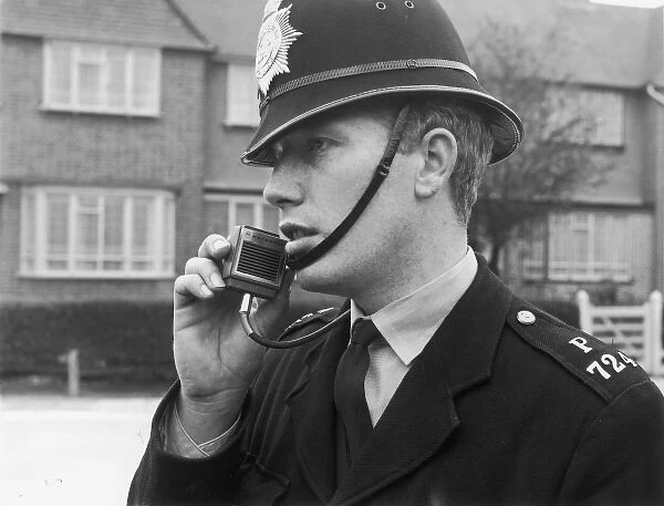 Police officer using a radio, London