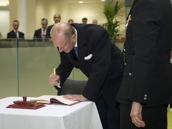 Prince Philip signing a register at the new LFB HQ