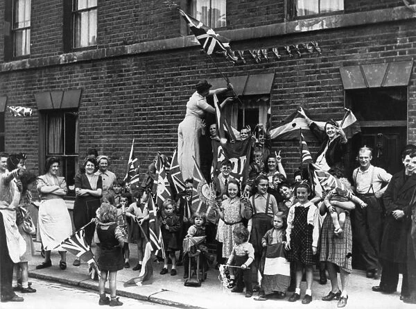 Street celebration with flags, VE Day