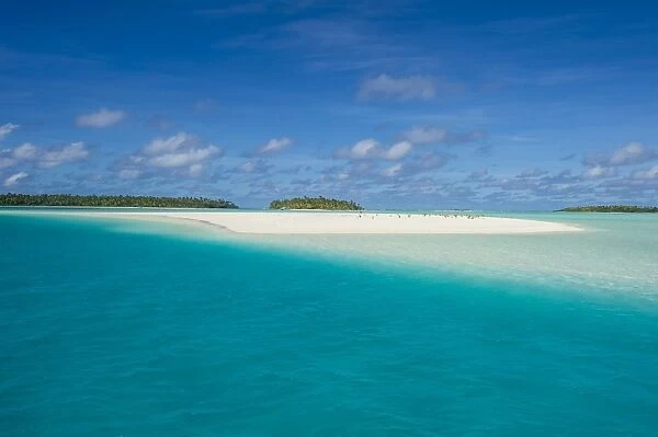 White sand beach and palm fringed beach in Aitutaki lagoon, Rarotonga and the Cook Islands