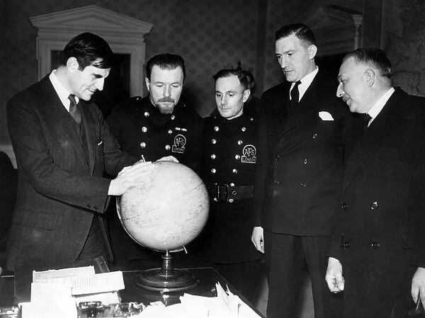 AFS men and others looking at a globe, WW2