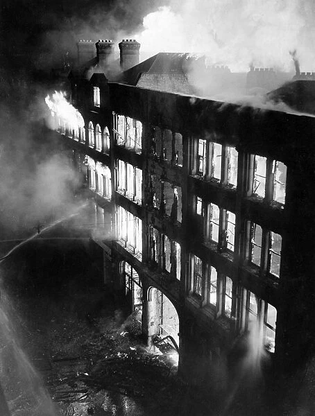 Blitz in London -- large building on fire, WW2