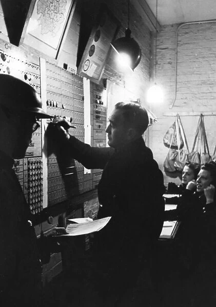 Blitz in London scene in a fire station control room, WW2