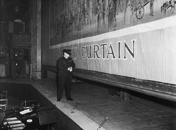 Fire prevention officer checking safety curtain