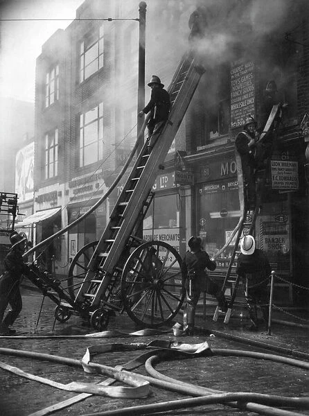 Firefighters in action in Commercial Road, East London