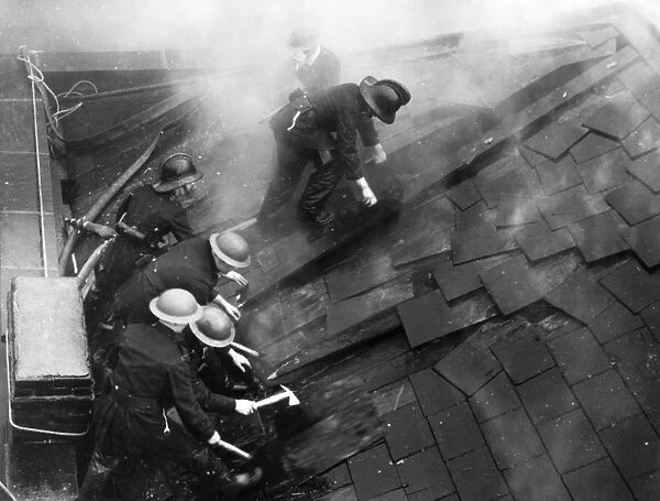 Firefighters cutting through a roof