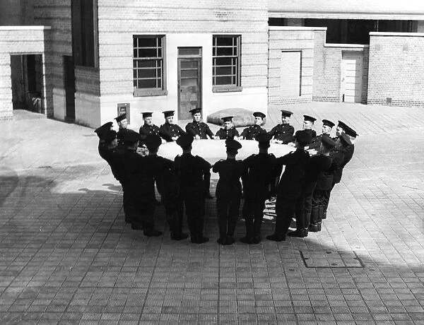 Firefighters with jumping sheet, Lambeth HQ, London