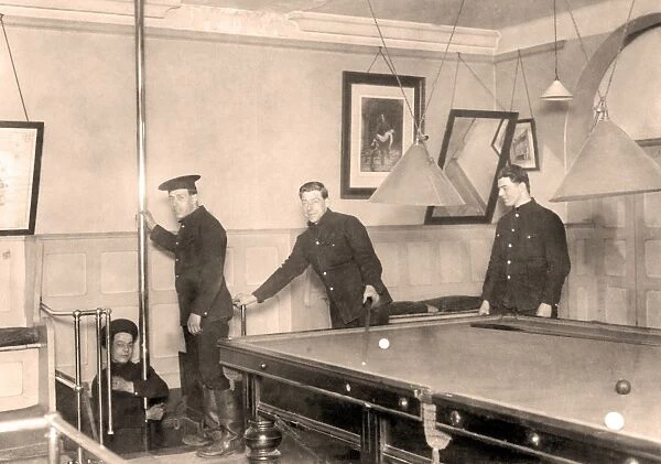 Firefighters playing billiards in a fire station