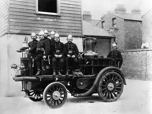 Firemen with early fire engine