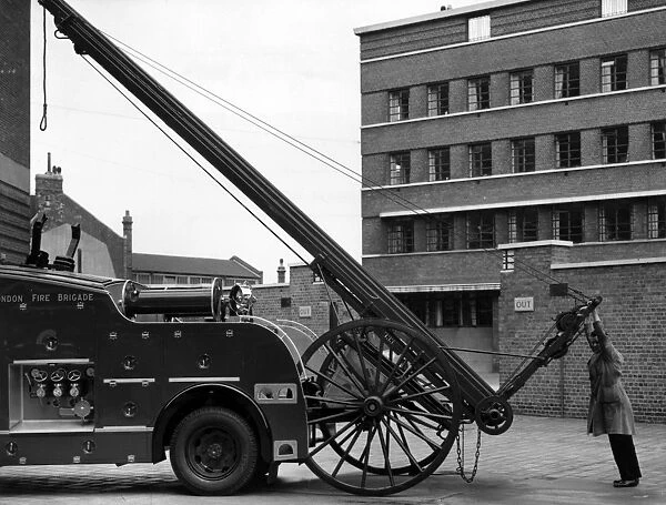 LFB fire engine with raised ladder (side view)