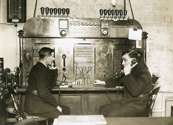 Two men on switchboard at LFB HQ