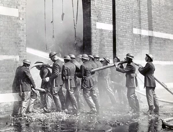 NFS (London Region) firemen with hose lines, WW2