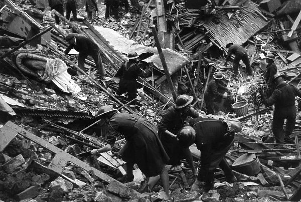Rescuers in debris after bombing raid, London, WW2