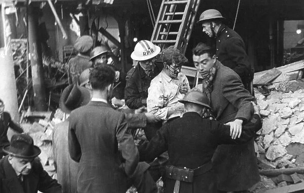 Rescuing casualty, Warwick Court, Holborn, WW2