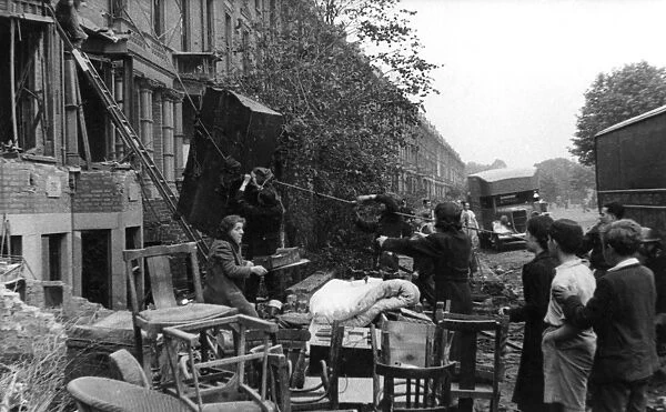 Salvaging furniture from damaged homes, London, WW2