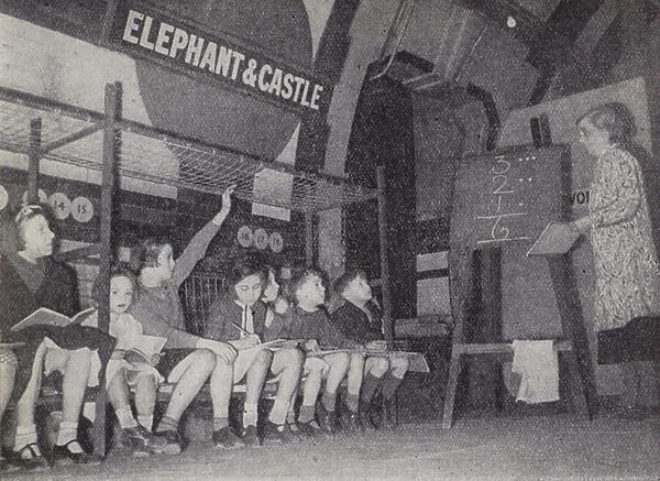 Children taking an evening class at Elephant and Castle Station on the London Underground during the Blitz, World War II, 1940 (b  /  w photo)