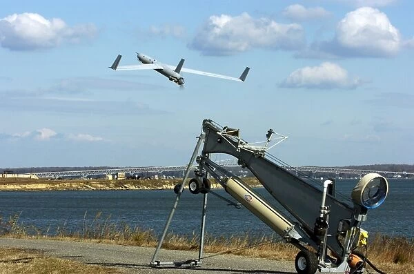 A ScanEagle unmanned aerial vehicle launches from a catapult