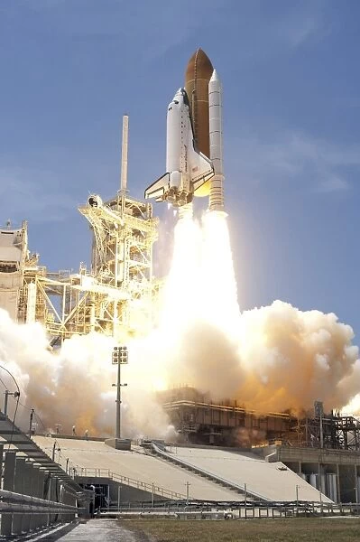 Space shuttle Atlantis twin solid rocket boosters propel to launch the spacecraft