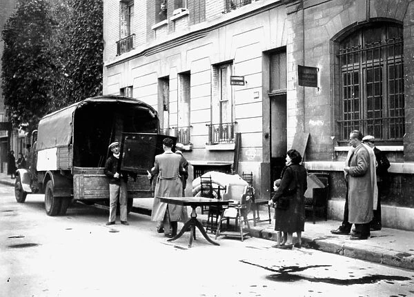 Delivery of furniture confiscated from Jews to victims of RAF bombing, Paris, April 1942