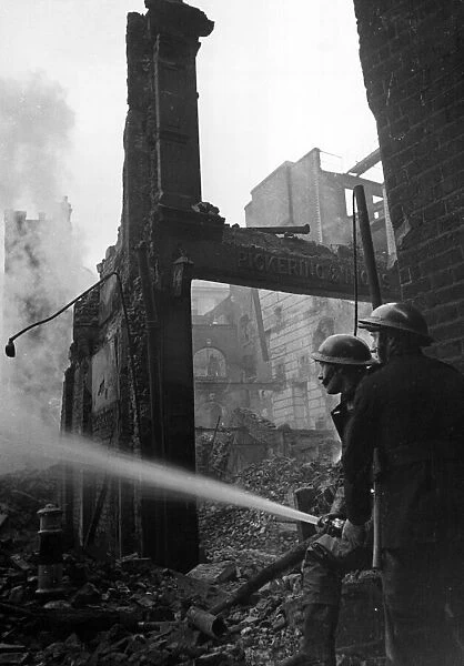 Firefighters in Paternoster Row, London. 30th December 1940