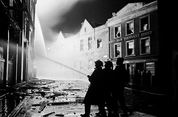 Firemen at work at Liptons Storehouse on Tabernacle St, Shoreditch