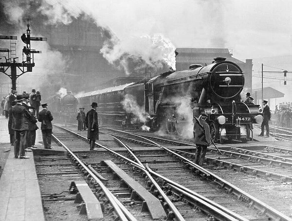 The Flying Scotsman steam train leaving Kings Cross station in London on its initial non