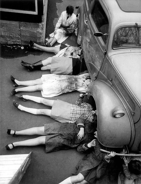 A group of Norwood Girls School pupils having a car maintenance lesson