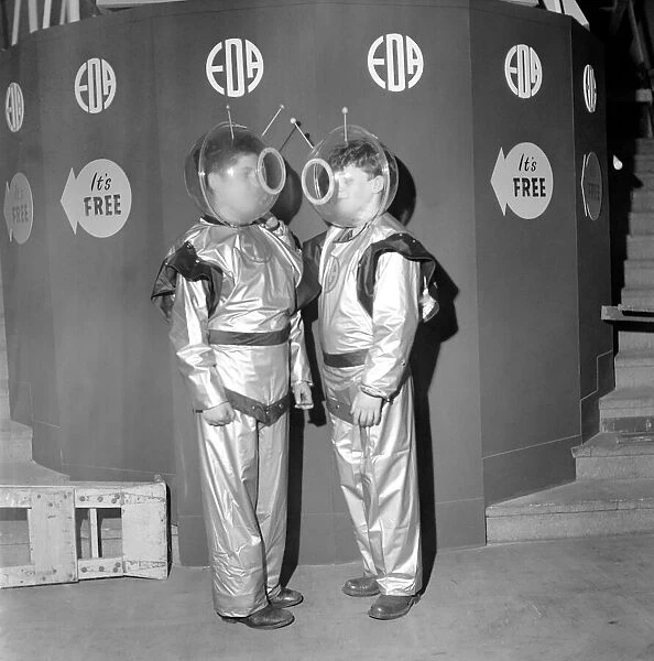 Schoolboys wearing space suits to board the Space Machine at a school exhibition