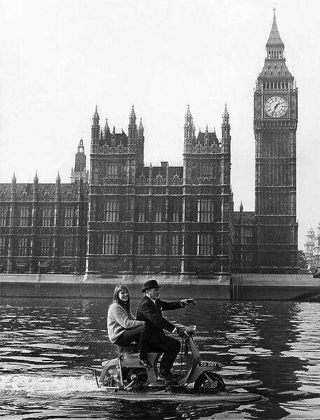 Skipper Hornsby and Stella scoot up the Thames at a fair rate of knots on their scooter