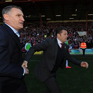 Bristol City Claims League Victory: Cotterill and Mowbray Share a Handshake Amidst Fans Euphoria