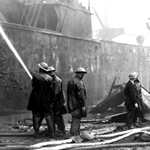 Blitz in London -- burnt out cargo ship, Rotherhithe, WW2