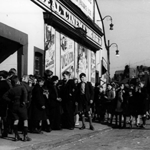 Children queuing outside cinema